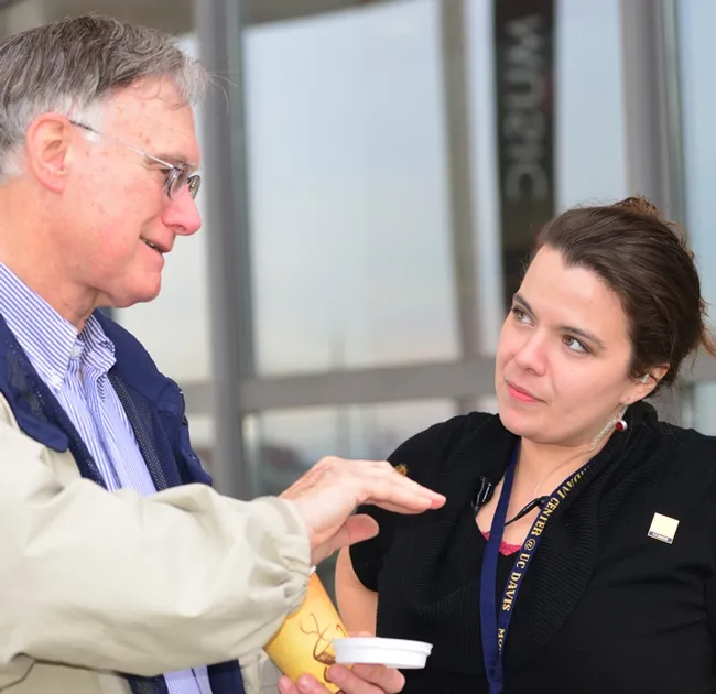 Bee guru Eric Mussen explains bee behavior to Mondavi house manager Kerrilee Knights. (Photo by Kathy Keatley Garvey)