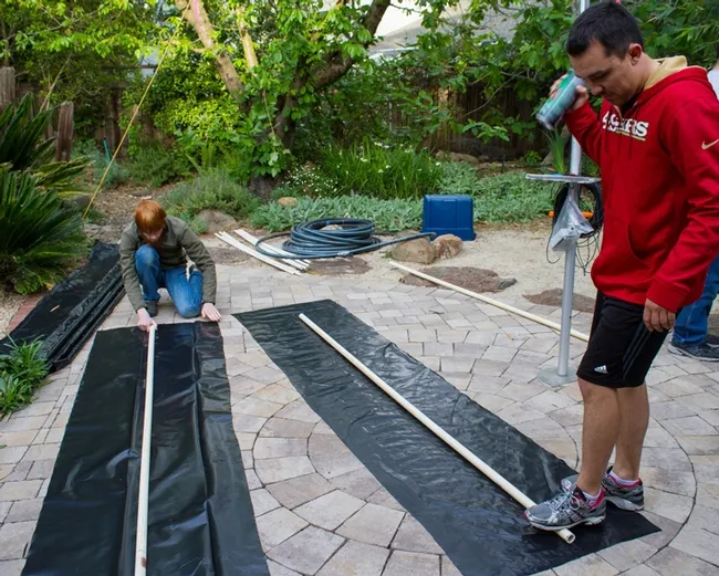 Working on the float are (from left) member Ben Maples and president Marko Marrero  (Photo by Alex Nguyen)