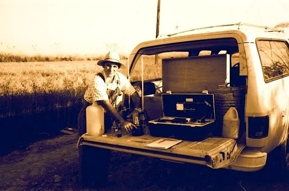 Medical entomologist William Reisen water-testing mosquito habitats near Lahore, Pakistan in 1976