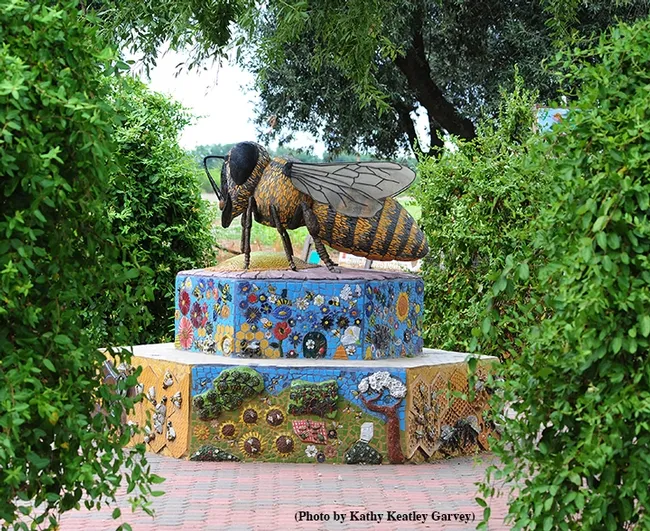 This is Miss Bee Haven, a ceramic-mosaic sculpture by self-described "rock artist" Donna Billick of Davis, co-founder and co-director of the UC Davis Art-Science Fusion. It anchors the H&auml;agen-Dazs Honey Bee Haven. (Photo by Kathy Keatley Garvey)