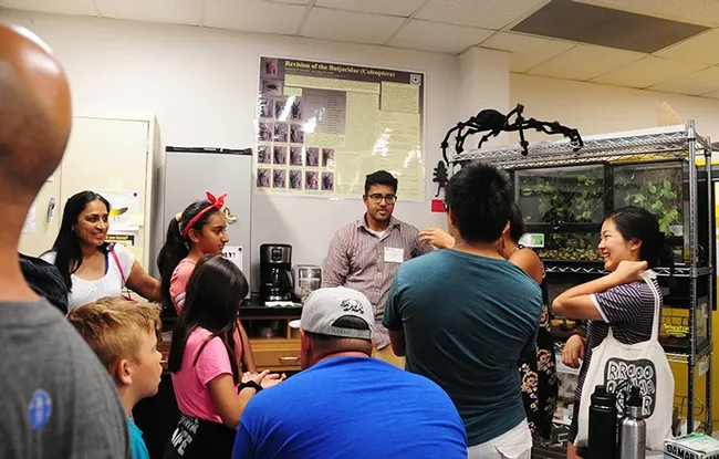 Bohart Museum associate and UC Davis entomology undergradate student Lohitashwa Garikipati (center) talks about the Bohart Museum's live petting zoo. (Photo by Kathy Keatley Garvey)