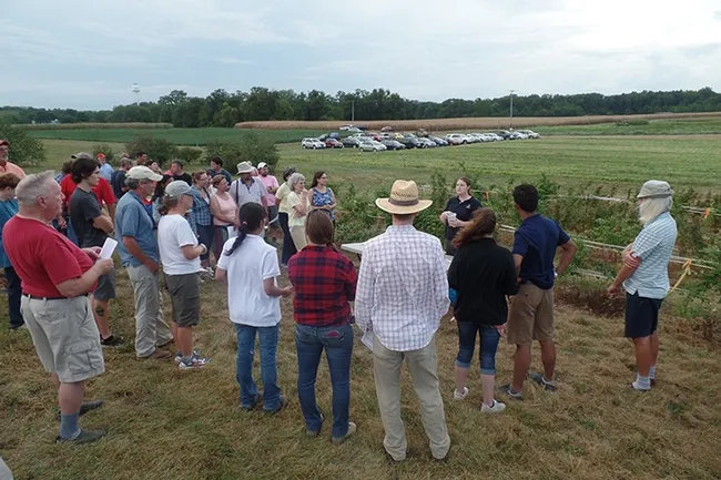 Kelly Hamby, assistant professor and Extension specialist in the Department of Entomology, University of Maryland, conducts a horticultural crop tour hosted by the Western Maryland Research and Education Center. The educational meeting gave fruit and vegetable producers a look at several of the ongoing projects at the research facility located in Washington County, MD, as well as the opportunity to interact with University of Maryland researchers and Extension specialists.
