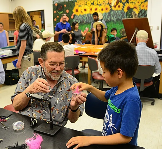 All finished, and it's yours! Steven Mao gratefully accepts the gift from mentor Dave Driscoll. (Photo by Kathy Keatley Garvey)