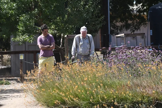 Photographer Allan Jones (right) talks about the bees he's photographed in the Häagen-Dazs Honey Bee Haven. (Photo by Kathy Keatley Garvey)