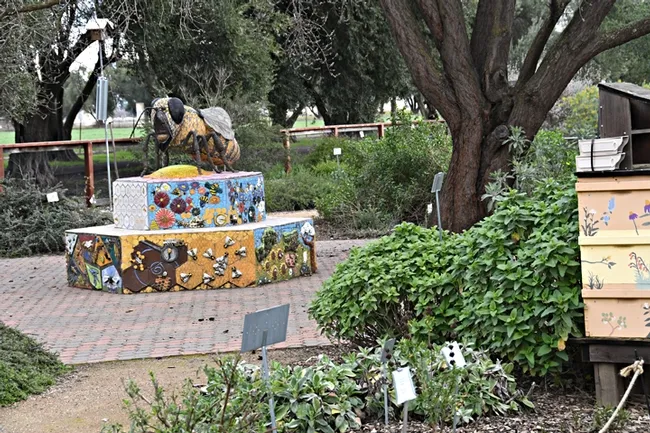 A six-foot-long mosaic and ceramic sculpture, Miss Beehaven, anchors the Häagen-Dazs Honey Bee Haven. It is the work of Donna Billick of Davis. (Photo by Kathy Keatley Garvey)