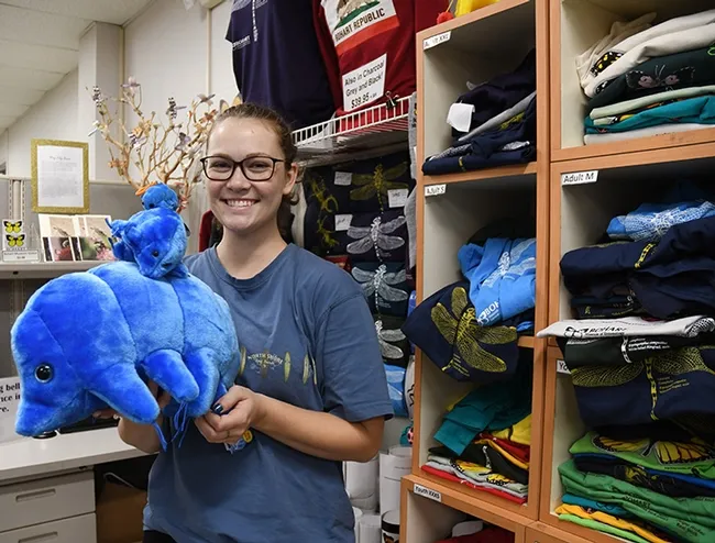 Entomologist Eliza Litsey, who received her bachelor's degree in entomology this year from UC Davis, shows some of the water bears (tardigrades) available in the Bohart Museum of Entomology gift shop. (Photo by Kathy Keatley Garvey)