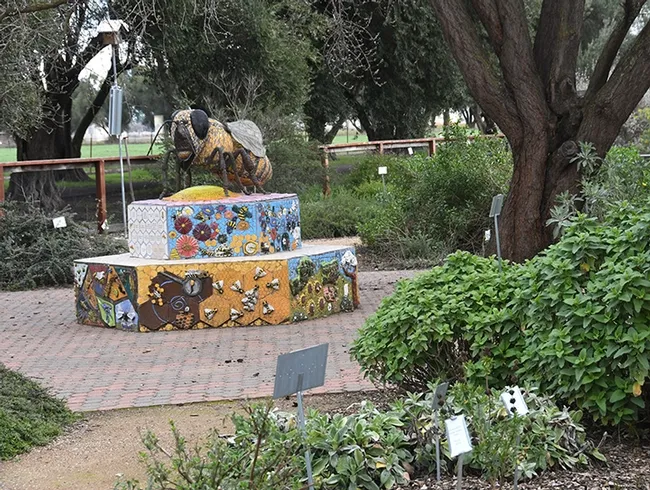 A six-foot-long worker bee, the work of artist Donna Billick, anchors the Häagen-Dazs Honey Bee Haven. (Photo by Kathy Keatley Garvey)
