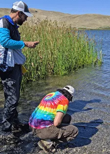 Greg Jesmok and Deepshikha Upadhyay sampling water from Quail Lake. Photo by P. Ganguli.