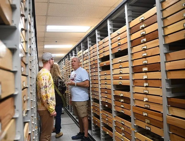 Entomologist Jeff Smith talks to visitors at a summer open house, pre-COVID precautions, at the Bohart Museum of Entomology. Smith curates the collection. (Photo by Kathy Keatley Garvey)