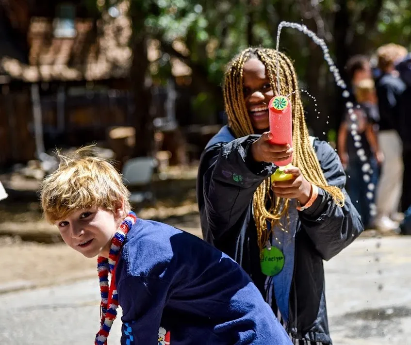 Image of children playing with water toys.
