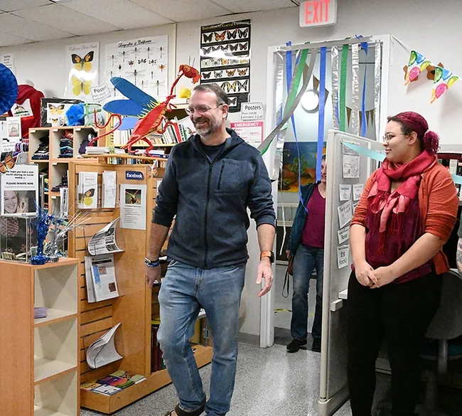 Associate dean Jason Bond leads professor Lynn Kimsey into the Bohart Museum after informing her of "the water leakage." At right is doctoral student Iris Quayle from the Bond lab.(Photo by Kathy Keatley Garvey)
