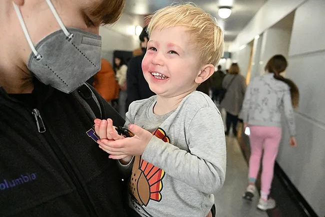 Finn Jensen's smile tells it all as he cradles the Madagascar hissing cockroach. (Photo by Kathy Keatley Garvey)