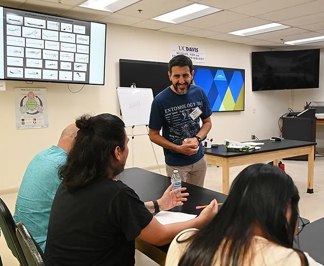 Professor Miguel Angel Miranda of the University of the Balearic Islands (UBI), Spain, teaching a workshop on "How to Draw Bugs." (Photo by Kathy Keatley Garvey)