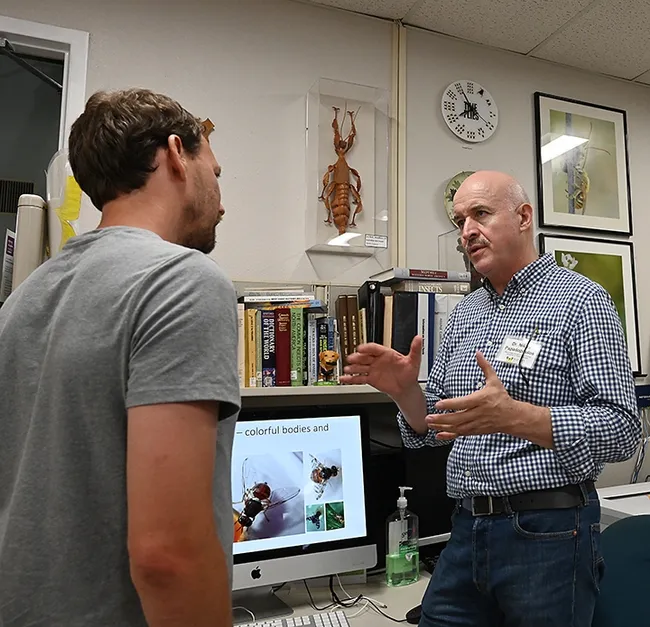 Tephritid fruit fly expert Nikos Papadopoulos of Greece answered questions about tephritid flies at the Bohart Museum of Entomology. (Photo by Kathy Keatley Garvey)