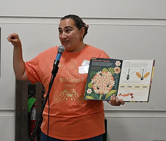 Nazzy Pakpour, a UC Davis alumna who holds a doctorate in microbiology, virology and parasitology from the University of Pennsylvania, read from her newly published children's book, "Please Don't Bite Me." (Photo by Kathy Keatley Garvey)