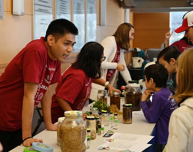 Doctoral student Nick Latina of Plant Pathology discusses the diversity of animal parasitic nematodes. (Photo by Kathy Keatley Garvey)