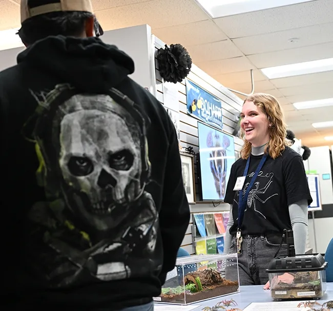 Doctoral candidate Emma "Em" Jochim answers a question about spiders. (Photo by Kathy Keatley Garvey)