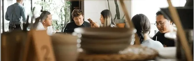 Employees at a cafe for a meeting.