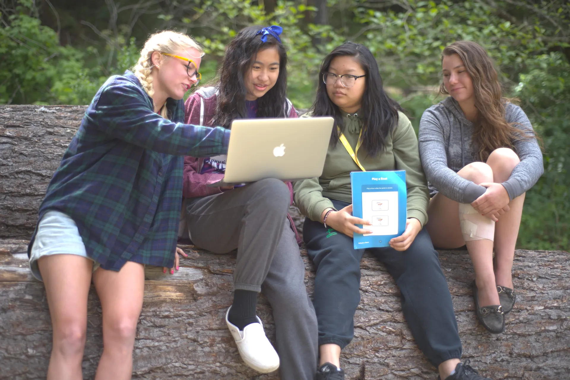 children looking at a laptop