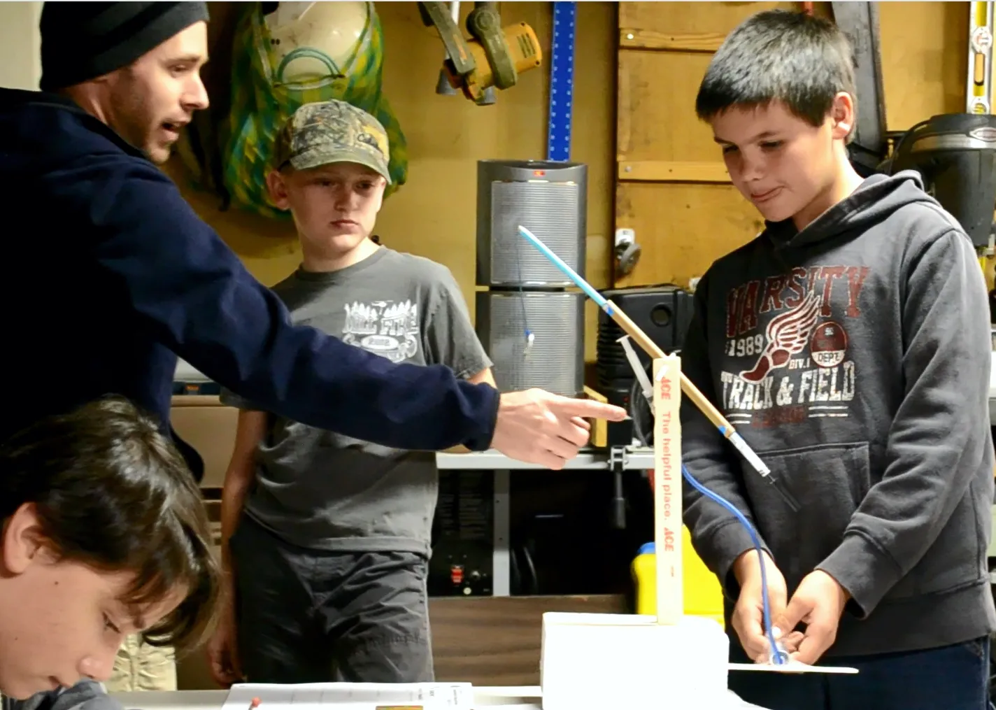 kids building a robotic arm and gripper