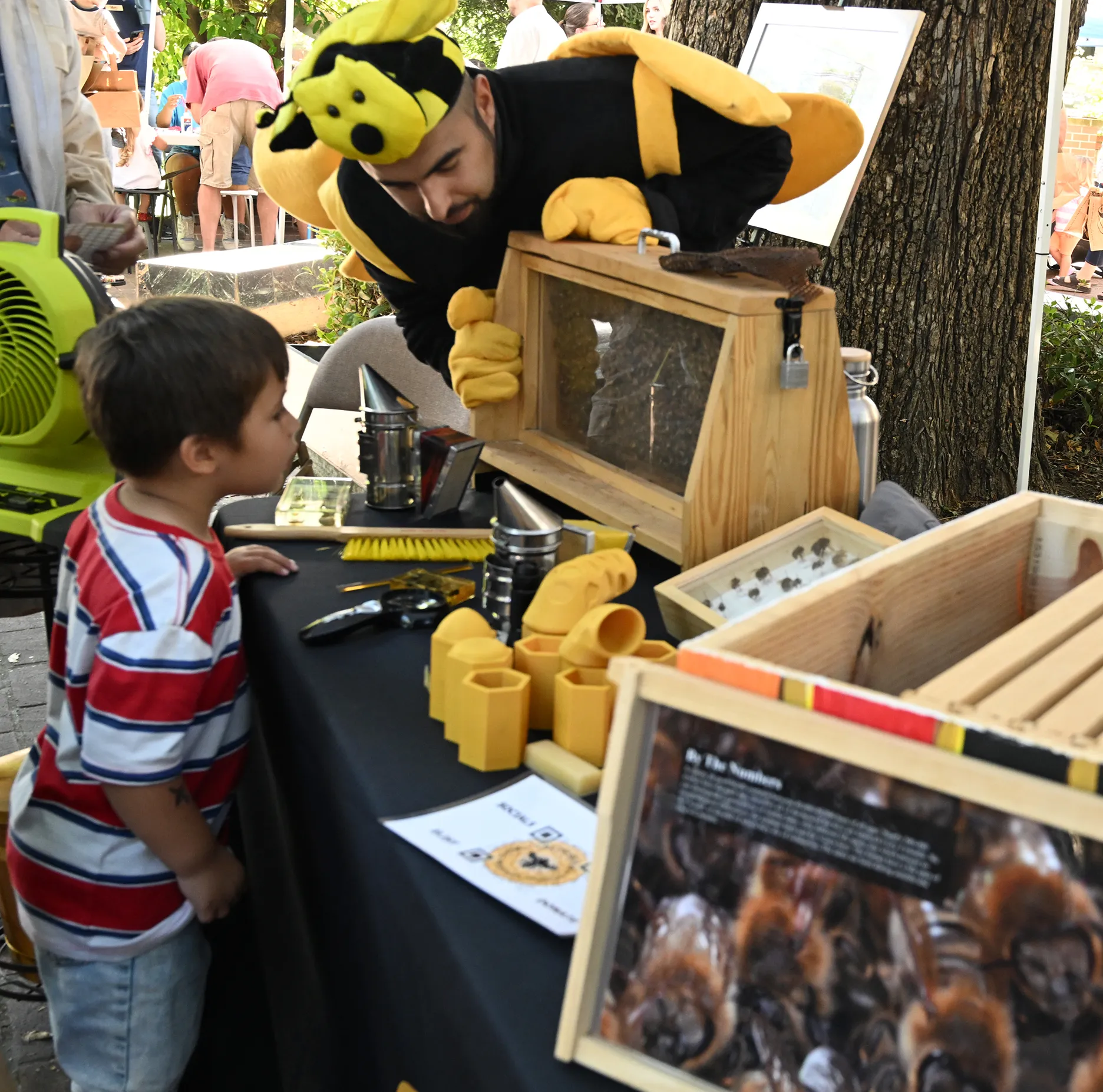 Kian Nikzad, co-program manager of the UC Davis-based California Master Beekeeper Program, shows the bee observation hive. (Photo by Kathy Keatley Garvey)