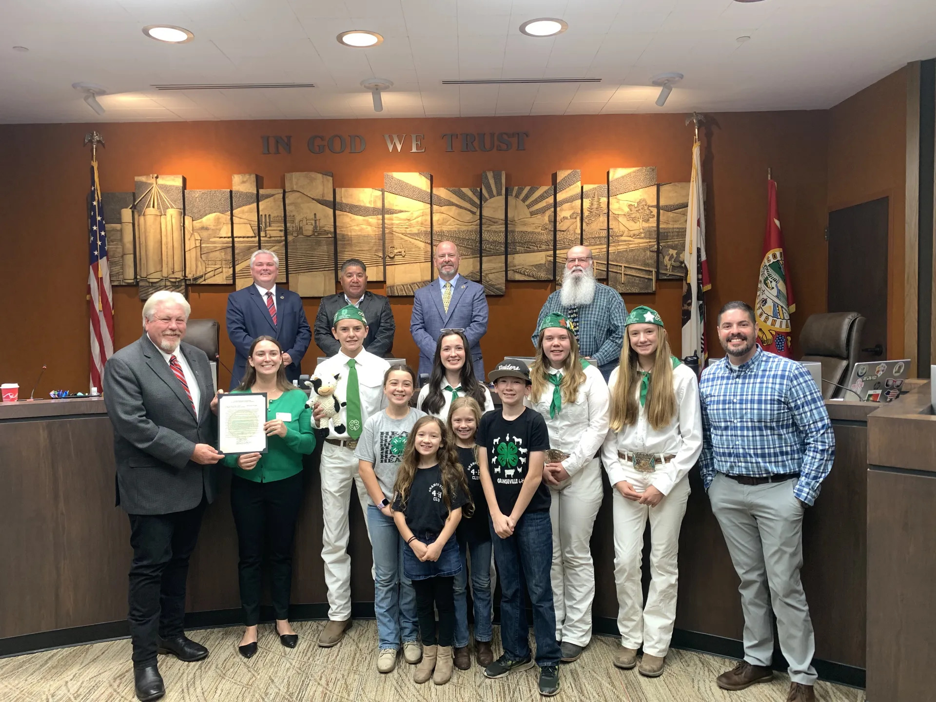 Leonel Jimenez (at far right) smiles with 4-H youth and Kings County Board of Supervisors