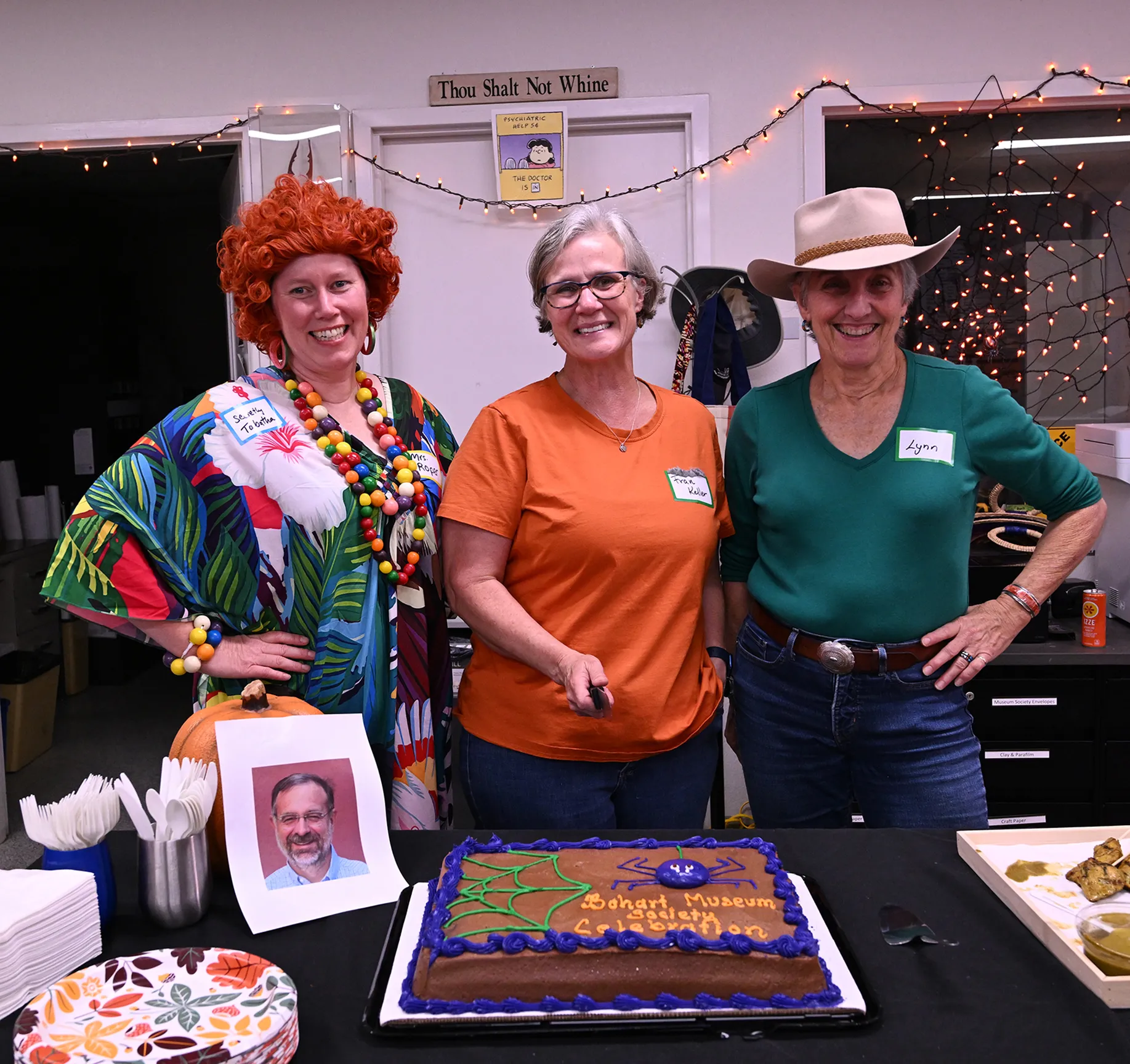 Cutting the Bohart Museum Society's cake are (from left) Tabatha Yang, the Bohart Museum's education and outreach coorinator; Professor Fran Keller and UC Davis Distinguished Professor Emerita Lynn Kimsey. (Photo by Kathy Keatley Garvey)