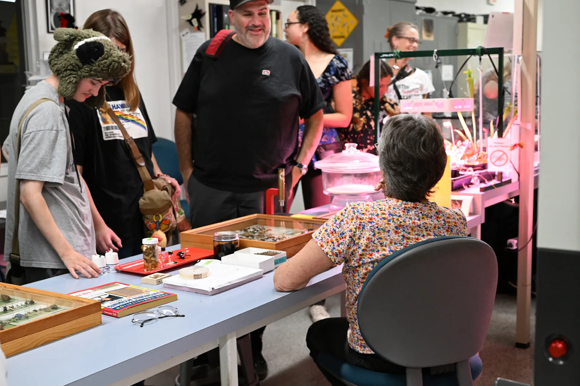 UC Davis Distinguished Professor Emerita Lynn Kimsey chats with UC Davis alumnus John Girarde, daughter, Tomas, and son, Victor, a newly enrolled UC Davis student majoring in entomology. (Photo by Kathy Keatley Garvey)