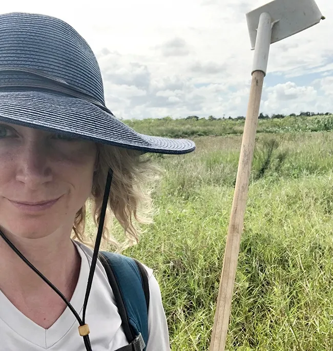 Medical entomologist Jenny Carlson Donnelly with a larval dipping cup to find larvae in the water.