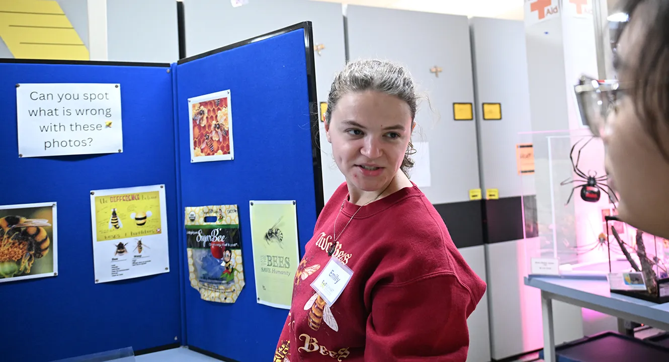 Emily Pearson, graduate student in the Neal Williams lab, answers a question. (Photo by Kathy Keatley Garvey)