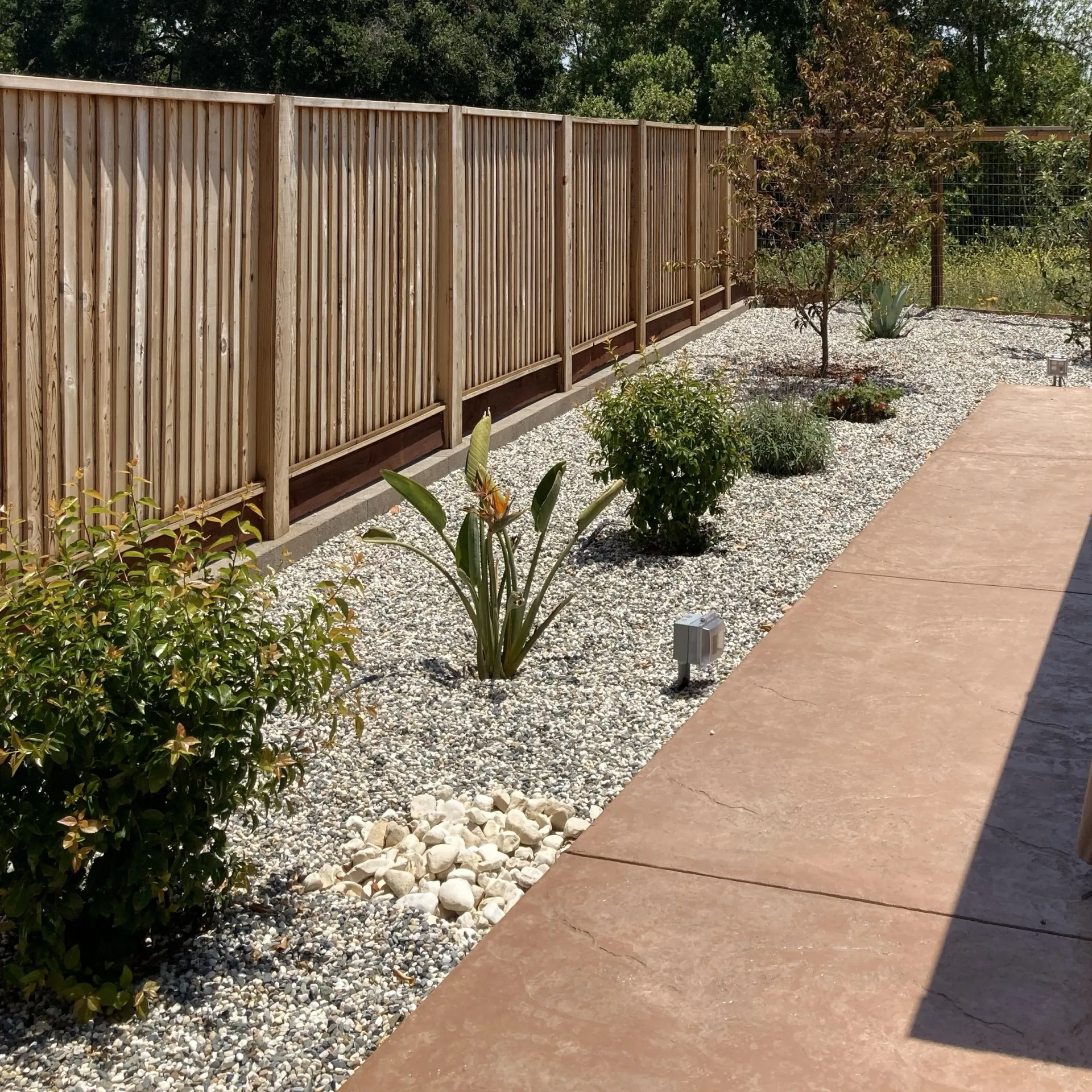 Firewise landscaping with defensible space around a fence