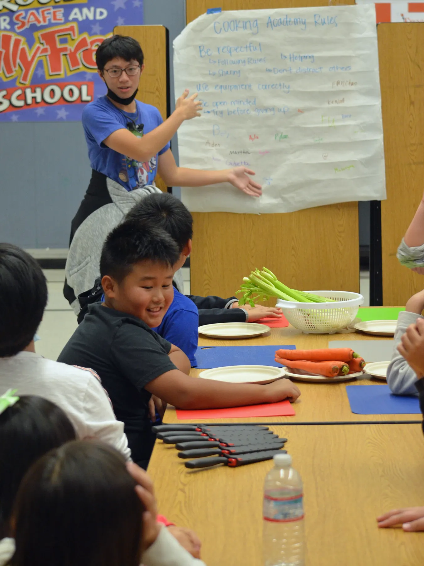 A teen teacher volunteer leads a Cooking Academy lesson at Mary Tsukamoto Elementary School in Sacramento, California.