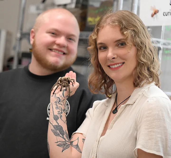 Felix Duley and Emma Jochim, co-chairs of the Bohart Museum of Entomology open house, with Peaches.