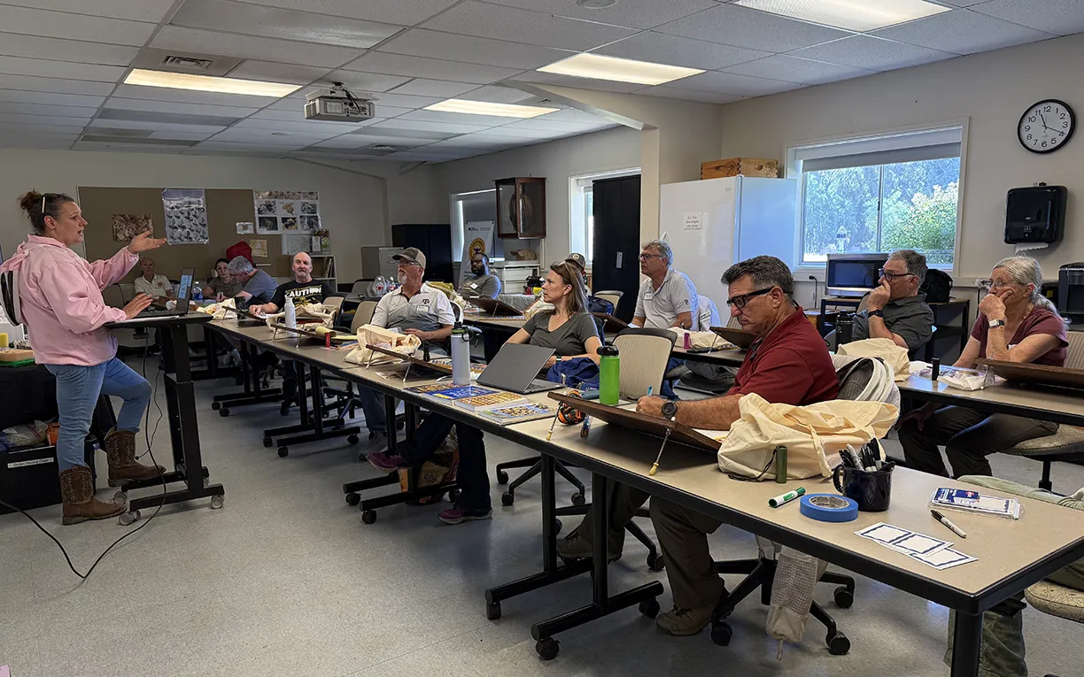 Bee scientist Elina Niño, professor of Cooperative Extension, apiculture, and a member of the UC Davis Department of Entomology and Nematology faculty, leads a queen-rearing class in June 2025. She is the founder and director of the UC California Master Beekeeper Program. (Photo by Kathy Keatley Garvey)