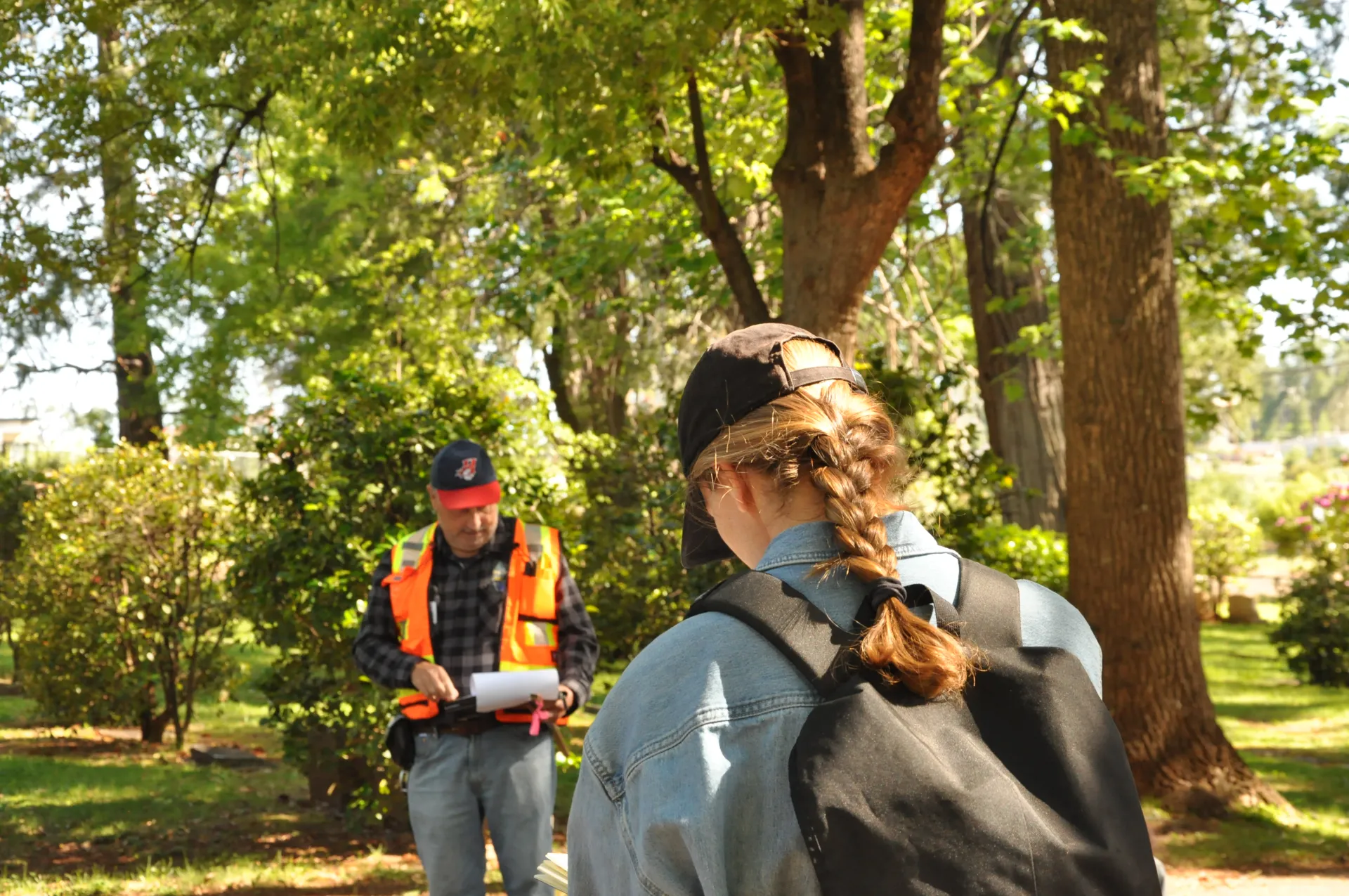 A CA Tree School participant takes notes during an outdoor class.