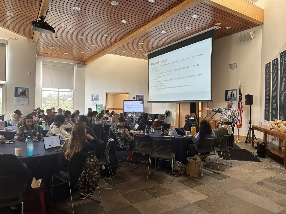 DroneCamp 2025 Participants listening to a talk on safety