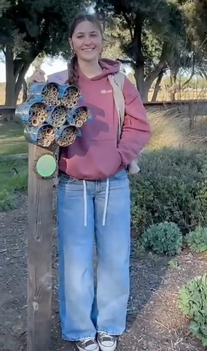 Girl Scout Sophie Webb with her "Bed for Bees."