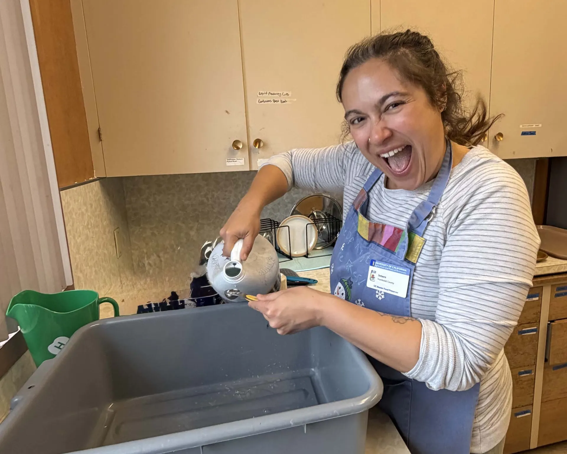 Adding bleach to make the sanitizing rinse.