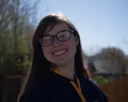 Example of not enough lighting on person smiling