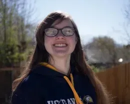 Example low light image of corrected lighting of youth smiling