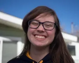 Smiling youth with diffused overhead lighting