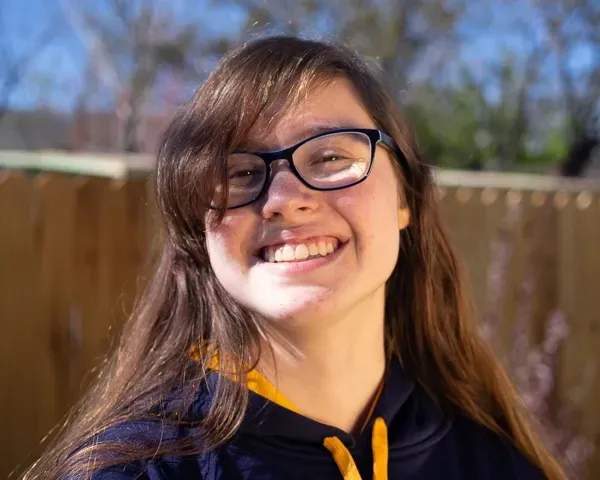 Youth with balanced light shining on smiling face