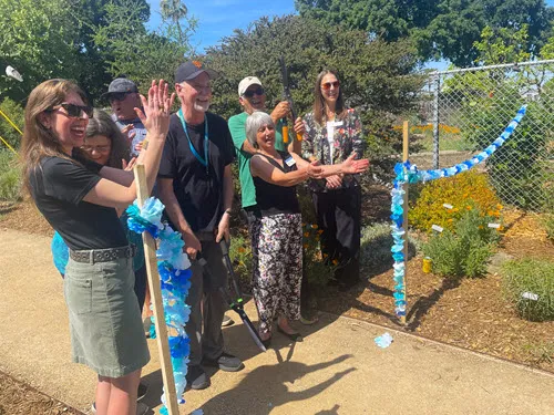 Concord Councilmember Carlyn Obringer, Phil Quinlan, and Dawn Kooyumjian help Cut the Ribbon