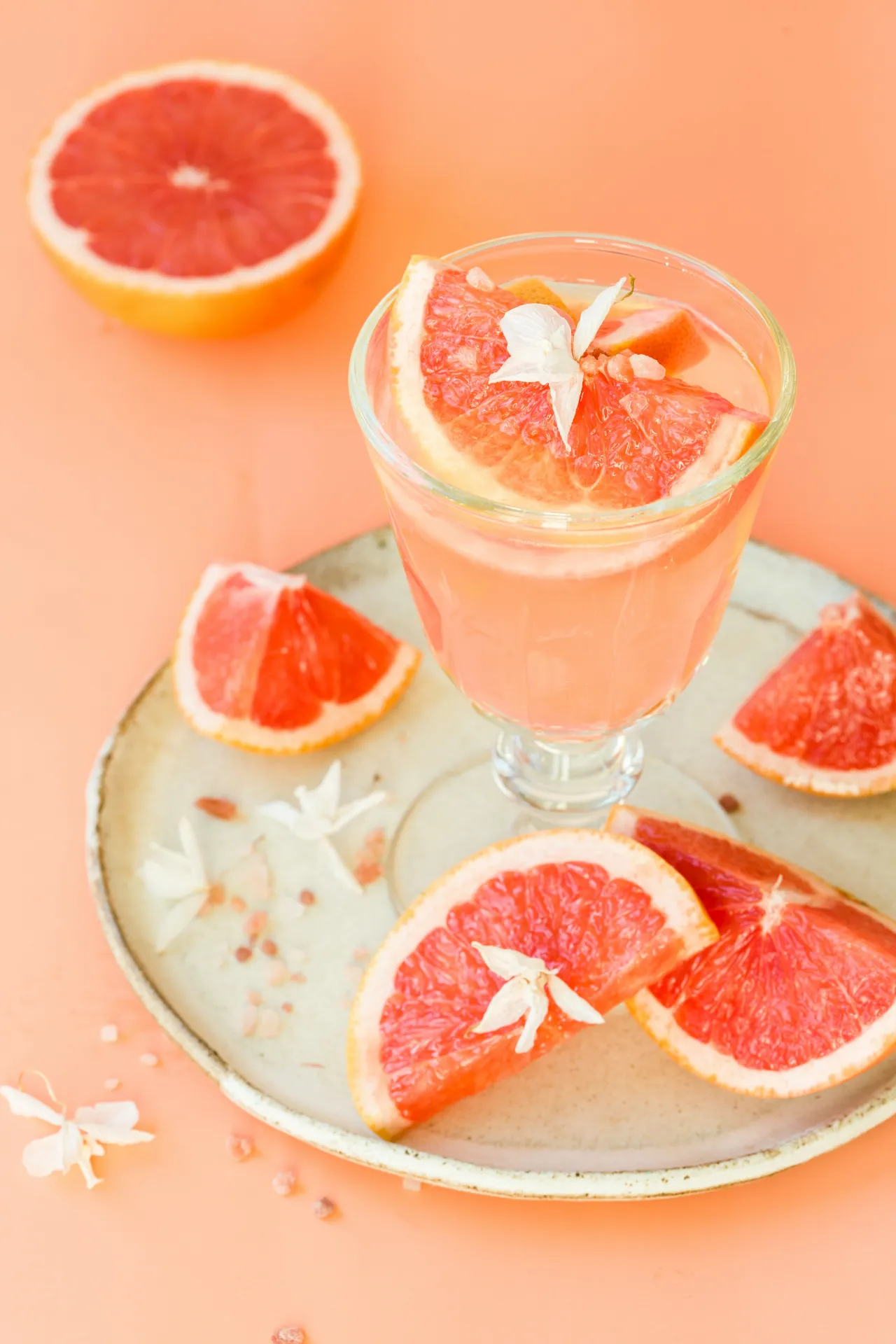 Orange flowers and slices to garnish a drink.