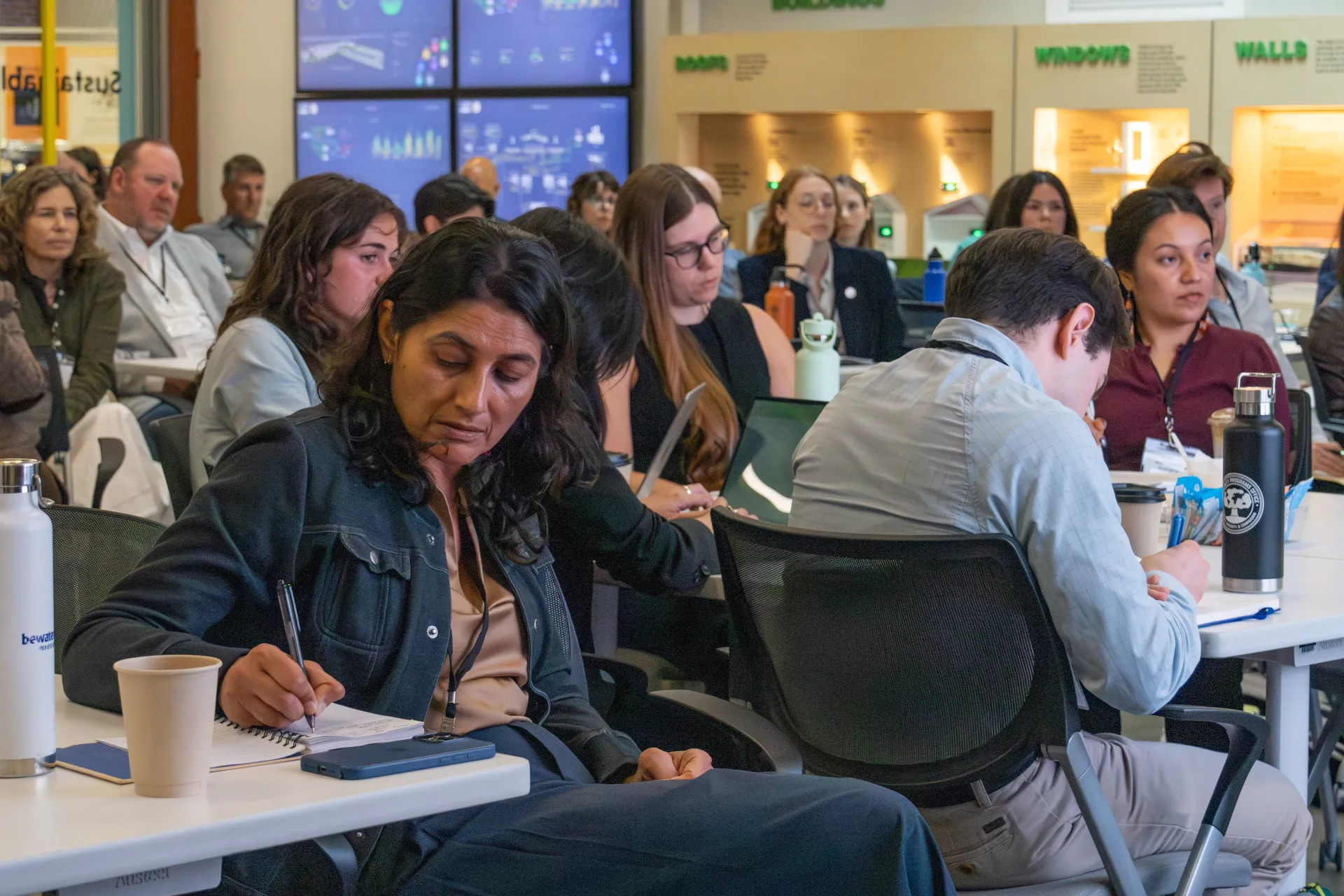 Participants listen during panel 1 of the workshop.