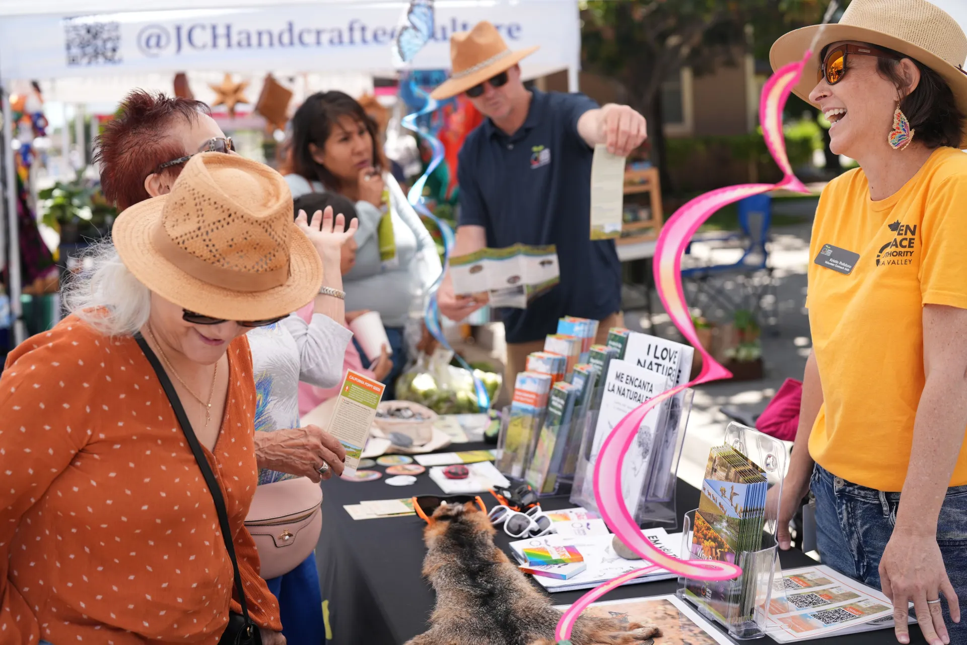 Kristin Polidoro laughs heartily while tabling for Santa Clara Valley Open Space Authority