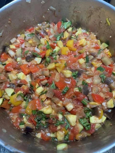 Ratatouille simmering in a pot stainless steel pot