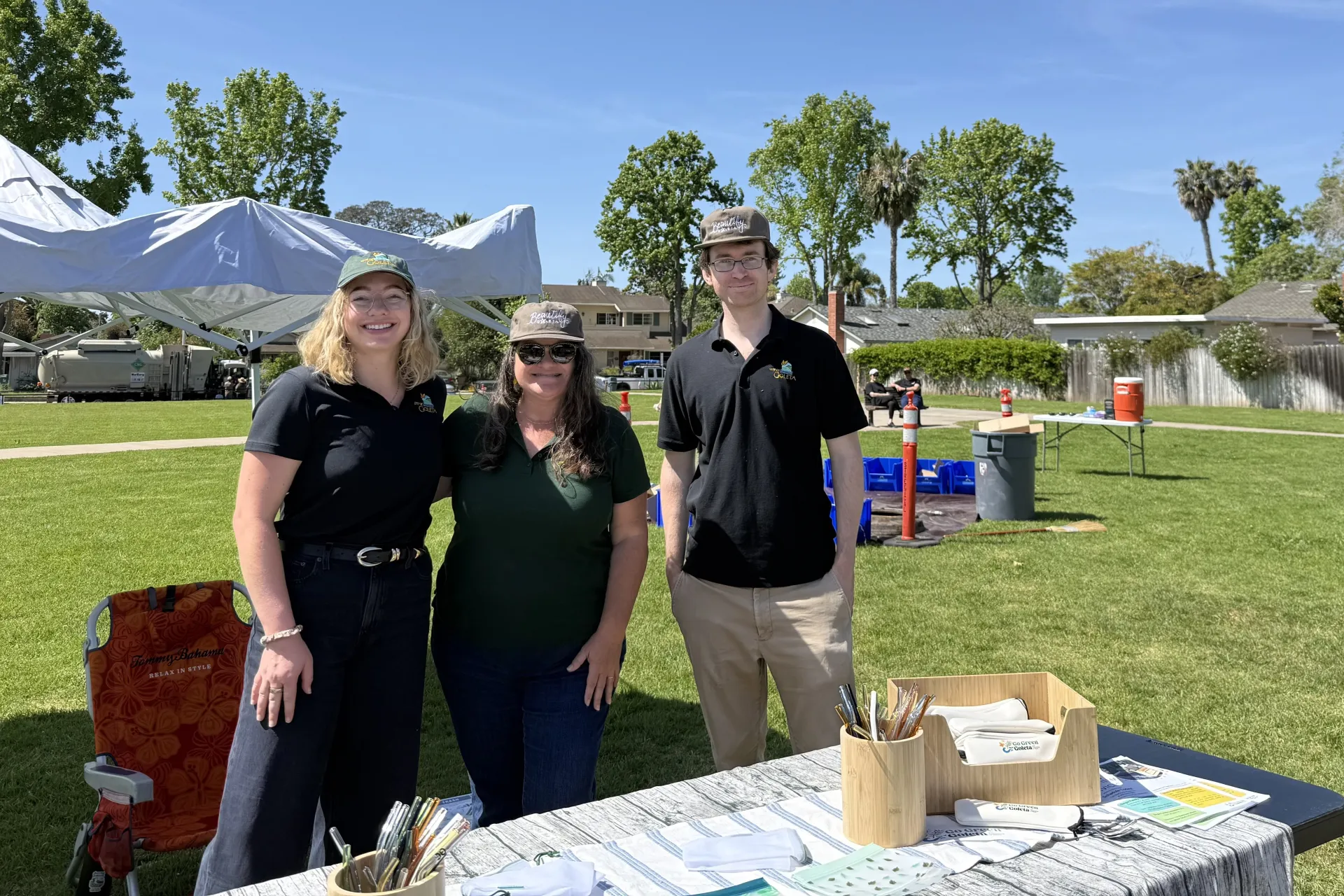 Jason Scott-Sheets (at right) stands at a table with City of Goleta Sustainability team members during a community cleanup event