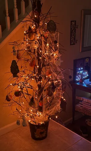 orange lit halloween decorated tree