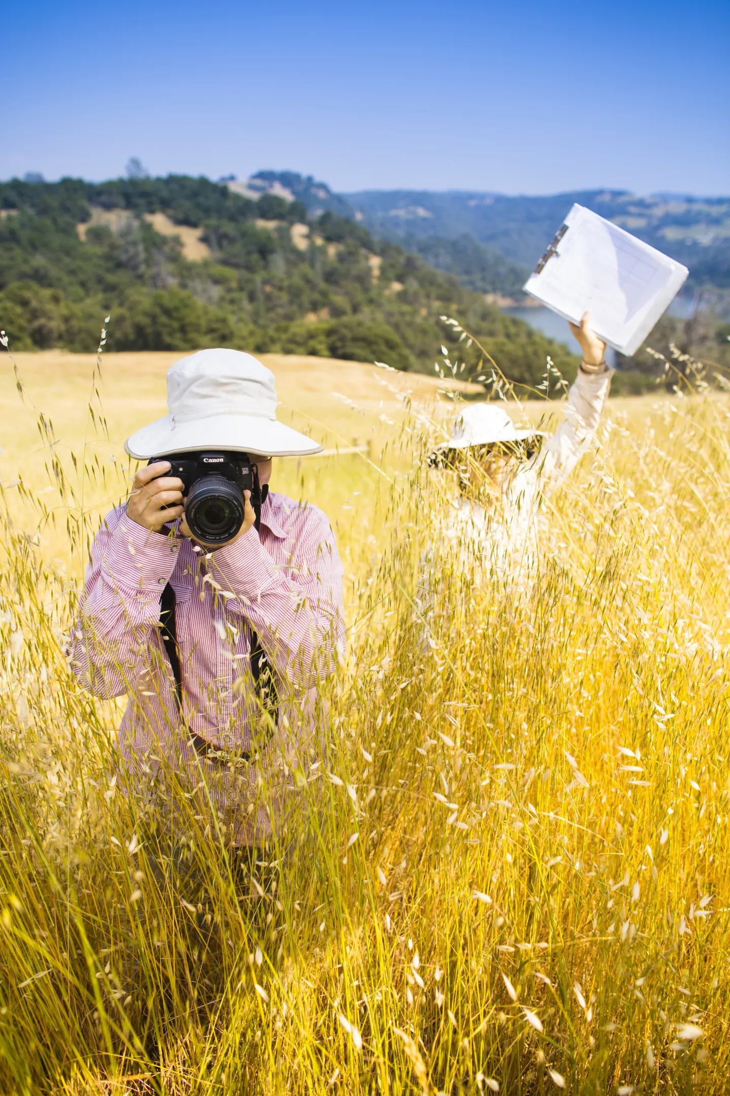 SFREC Researchers in the Field facing the camera with their camera